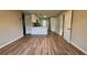Open-concept living space featuring wood-look flooring and a bright, airy atmosphere at 175 Center St, Daytona Beach, FL 32117