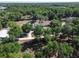 Aerial view of large property featuring expansive lawns and mature trees at 183 Mcgregor Rd, Deland, FL 32720