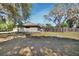 View of a spacious backyard with mature trees and privacy fencing at 183 Mcgregor Rd, Deland, FL 32720