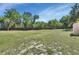 Expansive backyard featuring lush greenery and mature trees, perfect for outdoor enjoyment at 183 Mcgregor Rd, Deland, FL 32720