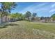 A view of the backyard with a wooden fence and spacious grassy area at 183 Mcgregor Rd, Deland, FL 32720