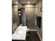 Updated bathroom featuring a tiled walk-in shower with a glass partition and modern fixtures at 183 Mcgregor Rd, Deland, FL 32720