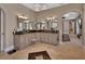 Bathroom with a long vanity, decorative mirrors, and patterned floor tile at 183 Mcgregor Rd, Deland, FL 32720