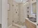 Modern bathroom with stone pebble shower flooring and decorative backsplash shelving at 183 Mcgregor Rd, Deland, FL 32720