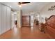 Bedroom with wood floors, closet with mirror door, and view to an adjacent room at 183 Mcgregor Rd, Deland, FL 32720