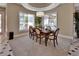 Elegant dining room with a large table and chairs, perfect for hosting dinner parties at 183 Mcgregor Rd, Deland, FL 32720