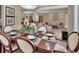 Formal dining room with a large table, comfortable chairs, and views of the living area and kitchen at 183 Mcgregor Rd, Deland, FL 32720