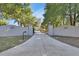 Long driveway entrance with brick pillars and house numbers on the walls at 183 Mcgregor Rd, Deland, FL 32720