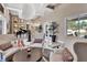 Luxurious foyer with piano, seating area, decorative rug, marble tile flooring and bright natural light from the exterior at 183 Mcgregor Rd, Deland, FL 32720