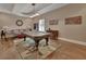 A large game room with a pool table, seating area, and wood floors, perfect for entertaining guests at 183 Mcgregor Rd, Deland, FL 32720
