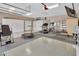 Spacious home garage complete with exercise equipment and white storage lockers at 183 Mcgregor Rd, Deland, FL 32720