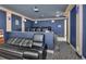 A comfortable home theater setup with leather seating and blue-toned walls, perfect for movie nights at 183 Mcgregor Rd, Deland, FL 32720