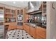 Well-equipped kitchen with stainless steel appliances, custom cabinets and large stainless hood at 183 Mcgregor Rd, Deland, FL 32720