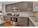 Bright kitchen with granite counters, stainless appliances, ample counter space, and stylish cabinets at 183 Mcgregor Rd, Deland, FL 32720