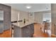 Open-concept kitchen flowing into the living area, featuring granite island with seating at 183 Mcgregor Rd, Deland, FL 32720