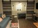 Open-concept living area with a decorative sliding barn door leading to a bedroom, creating a cozy and inviting space at 183 Mcgregor Rd, Deland, FL 32720