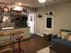 Open living area with a cozy seating area, a kitchen, and vintage decor throughout at 183 Mcgregor Rd, Deland, FL 32720