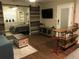 Stylish living area featuring a decorative sliding barn door, seamlessly connecting the living space to bedroom at 183 Mcgregor Rd, Deland, FL 32720