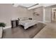 Serene main bedroom with dark wood floors, neutral walls, and access to an en suite bathroom at 183 Mcgregor Rd, Deland, FL 32720