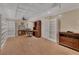 Spacious home office with custom bookcases, wood floors, decorative ceiling, and recessed lighting at 183 Mcgregor Rd, Deland, FL 32720