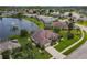 Gorgeous aerial view of lakeside homes and lush lawns in desirable neighborhood at 1860 Forough Cir, Port Orange, FL 32128
