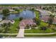 Beautiful aerial shot of house and neighborhood with a lake, fountain, and well kept lawns at 1860 Forough Cir, Port Orange, FL 32128