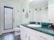 Bathroom with ample storage space, shower and bath combination, and access door to outside at 1860 Forough Cir, Port Orange, FL 32128