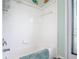 Bathroom shower featuring white tiled surround, grab bar, and a teal rug at 1860 Forough Cir, Port Orange, FL 32128