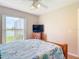 Bedroom featuring a lake view, dresser with TV and ceiling fan at 1860 Forough Cir, Port Orange, FL 32128