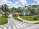 A welcoming entrance sign for Waters Edge community, surrounded by lush greenery and mature trees at 1860 Forough Cir, Port Orange, FL 32128