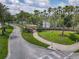 A welcoming entrance sign for Waters Edge community, surrounded by lush greenery and mature trees at 1860 Forough Cir, Port Orange, FL 32128