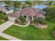 Beautiful home with pristine front lawn, lush landscaping, and inviting entrance at 1860 Forough Cir, Port Orange, FL 32128