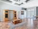 Large open living room featuring tile floors, a custom tray ceiling, and lots of open space at 1860 Forough Cir, Port Orange, FL 32128