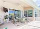 Outdoor patio featuring fan, furniture, and view of water at 1860 Forough Cir, Port Orange, FL 32128
