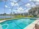 Screened in pool overlooking the lake, complete with a hot tub at 1860 Forough Cir, Port Orange, FL 32128