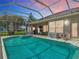Screened pool with spa, exterior lounge area, and covered patio provide a relaxing retreat at 1860 Forough Cir, Port Orange, FL 32128