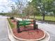 Entrance sign for Airport Road Park with landscaping and a walking path at 1860 Forough Cir, Port Orange, FL 32128