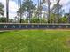 A welcoming entrance sign for Waters Edge community, surrounded by manicured landscaping at 1860 Forough Cir, Port Orange, FL 32128
