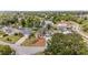 Aerial view showcasing the home's proximity to a tranquil lake at 1862 Shelby Ter, Deltona, FL 32725