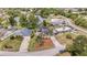 Aerial view of a home with solar panels, a pool, and lake access with a dock at 1862 Shelby Ter, Deltona, FL 32725
