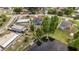 Aerial view of a neighborhood with a lake and many homes, some with pools at 1862 Shelby Ter, Deltona, FL 32725