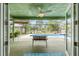 Covered back porch view of screened in pool with a lake in the background at 1862 Shelby Ter, Deltona, FL 32725