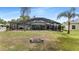 Expansive backyard with a screened pool area, offering privacy and outdoor enjoyment at 1862 Shelby Ter, Deltona, FL 32725