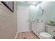 Well-lit bathroom featuring a modern vanity, mirror, and a toilet at 1862 Shelby Ter, Deltona, FL 32725