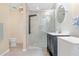 Bathroom featuring a sleek glass shower with a multi-setting fixture and modern vanity at 1862 Shelby Ter, Deltona, FL 32725