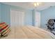 Comfortable bedroom featuring a large closet, ceiling fan, and neutral tones at 1862 Shelby Ter, Deltona, FL 32725