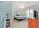Comfortable bedroom with a ceiling fan, large window, and charming decor touches at 1862 Shelby Ter, Deltona, FL 32725