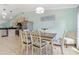 Dining area with stainless steel appliances, open to kitchen, and comfortable seating at 1862 Shelby Ter, Deltona, FL 32725