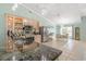 Well-lit kitchen featuring granite countertops, stainless steel appliances, and adjoining dining area at 1862 Shelby Ter, Deltona, FL 32725