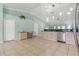 Spacious kitchen with tiled flooring, light wood cabinets, and adjoining work space at 1862 Shelby Ter, Deltona, FL 32725